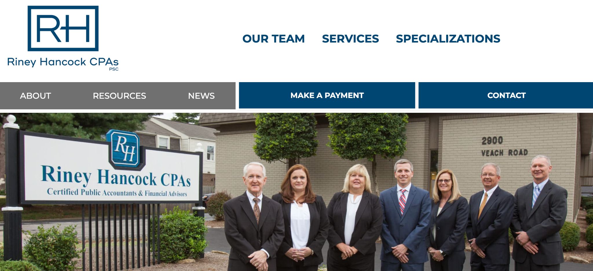 Riney Hancock CPAs staff members standing outside their Owensboro office building